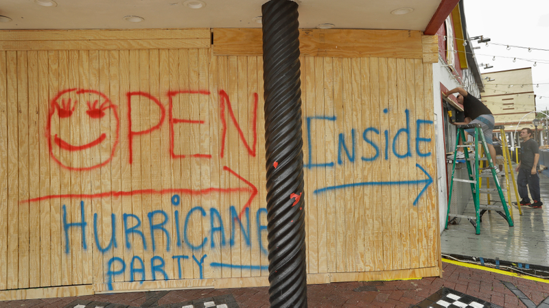 Michael Blackman, left, and Sam Titus board up a bar a few blocks off the beach Thursday, Oct. 6, 2016, in Daytona Beach, Fla. Hurricane Matthew continues to churn its way toward Florida’s east coast. The bar is planning on staying open during Matthew. (Image: AP)